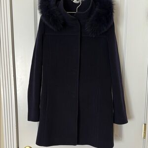 Sleek mid-length wool-cashmere blend coat with fox fur trimmed hood